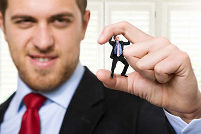 SRS Legal_Bullying-in-workplace: businessman-crushing