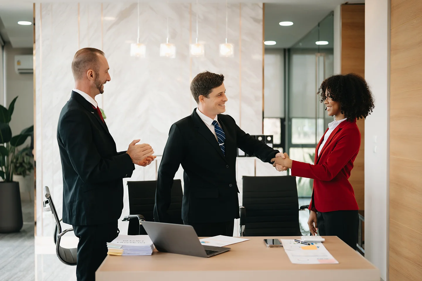 Business People Shaking Hands During A Meeting